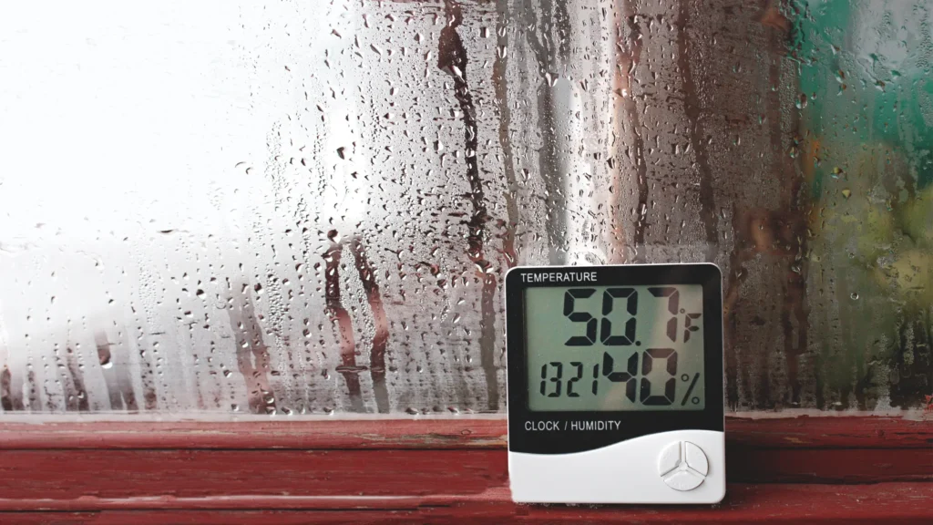 Condensation on window with temp/humidity/clock reader
