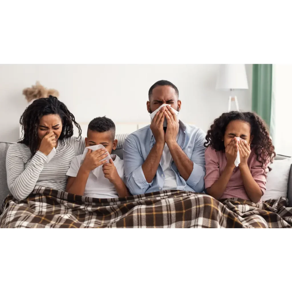 Picture of family sneezing due to poor indoor air quality.